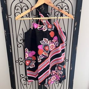 Floral racerback tank top with twisted straps.